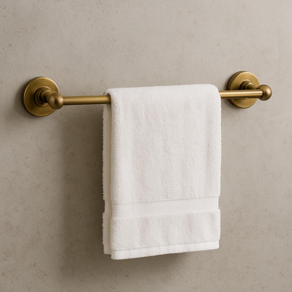 Brass towel rail mounted on a bathroom wall
